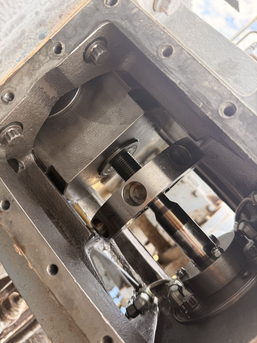 Compressor crosshead and piston rod with inspection cover removed